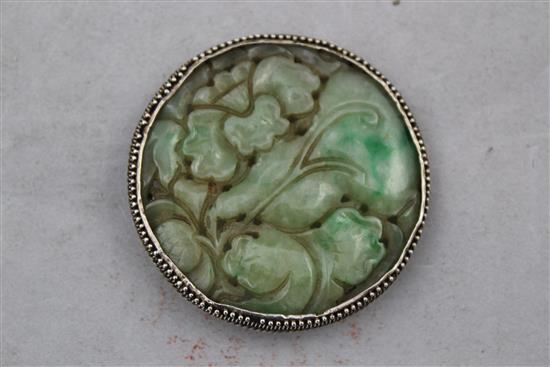 A Chinese jadeite circular plaque, 19th century, 5cm diam.